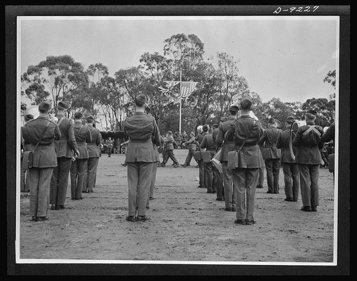 Australia in the war. To the music of an American infantry regiment band, Australian troops of an armored division march past a saluting base during an inspection by their commander-in-chief, Sir Thomas Blamey
