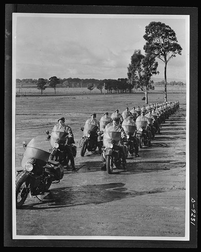 Australia in the war. American motorcycles, furnished under lend-lease, are used in this formation of Australian cyclists, part of the growing mechanized army which the Commonwealth is training