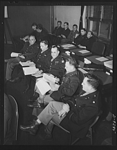 Combined Munitions Assignments Board. Staff members of the Combined Munitions Assignments Board attend the weekly meetings in Washington. In the foreground, left to right are: Colonel J.Y. York, Jr. (American); Colonel C.M. Steese (American); Colonel W.H. Hobson (American); Brigadier General P.H. Ta