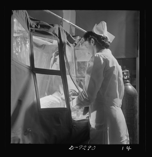 Nurse training. As students become proficient they will relieve graduate nurses from duties such as this: tending a patient in an oxygen tent