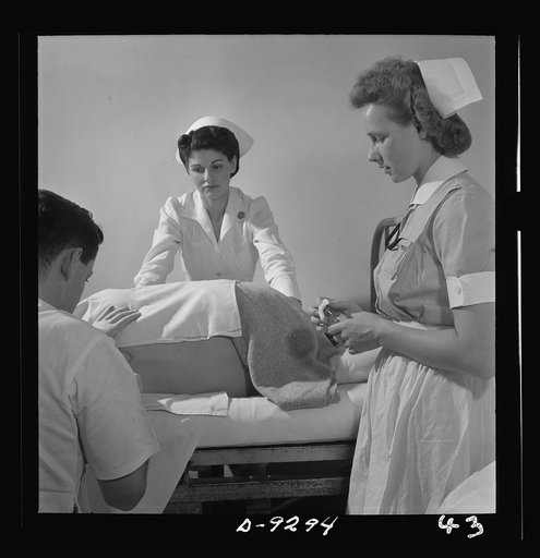 Nurse training. A student nurse (right) assists the doctor with a lumbar puncture, an important diagnostic procedure for back diseases or injuries. The student must sterilize needles and manometer, get the patient into correct position, prepare the skin area which will be punctured, and take charge 