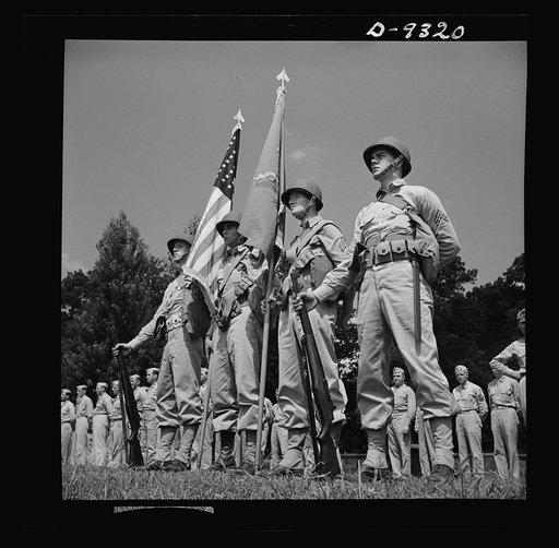 Fort Myer, Virginia. Husky six-foot soldiers stand in review at ceremonies at Fort Myer, Virginia, honoring Staff Sergeant Jackson L. Dietz, Jr. and Technical Sergeant Raymond Davidson, for rescuing a comrade from a fire in the company machine shop