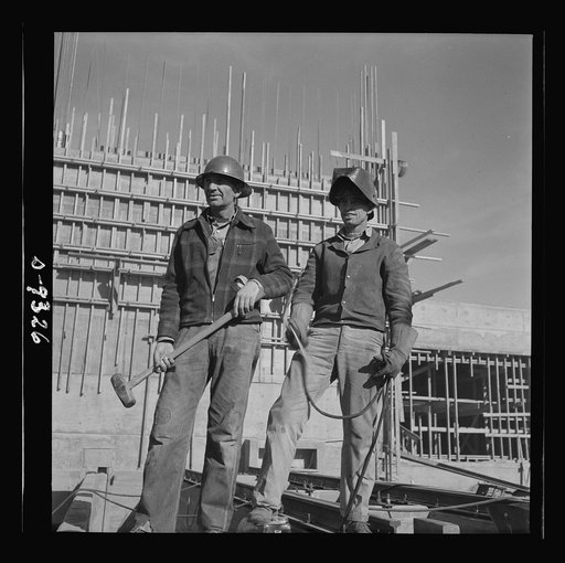 Production. Magnesium. A rigger and a welder at the new Basic Magnesium plant in the southern Nevada desert look out across the growing impressiveness of the plant they are helping to build