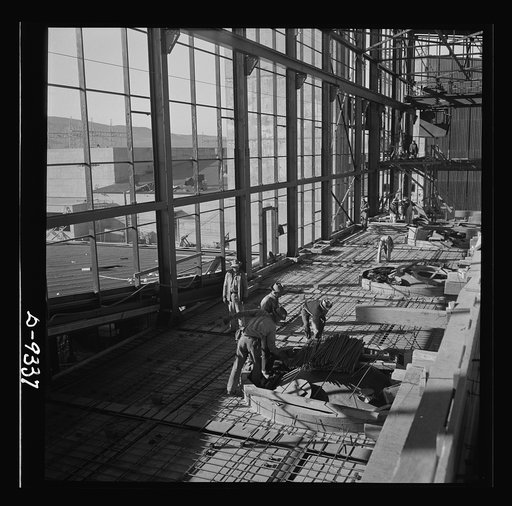 Production. Magnesium. High above the Nevada desert workmen lay reinforcing steel for the concrete floor of one of the 360-foot-long chlorination buildings at Basic Magnesium's huge plant near Las Vegas