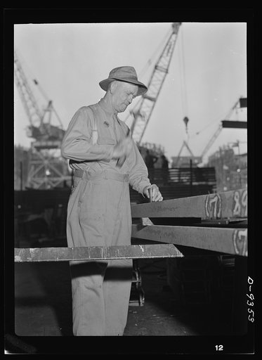 Baseball players in war production. George Stovall, retired manager of the Cleveland Indians, does his bit at the California Ship Building Corporation where he helps build Liberty ships