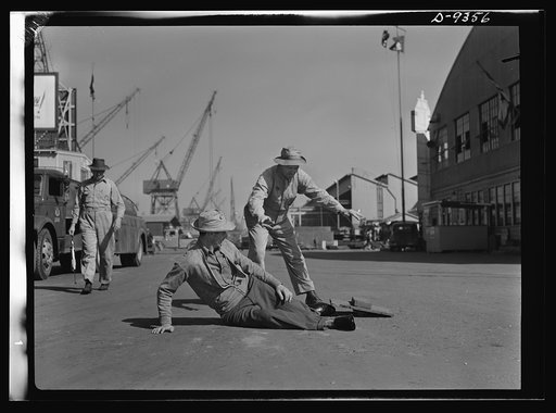 Baseball players in war production. "Safe," signals George Stovall, retired manager of the Cleveland Indians as Vince DiMaggio slides home during a lunch-hour softball game in the California Shipbuilding Corporation shipyards. DiMaggio, Pittsburgh Pirates outfielder, has been a warehouseman at the C