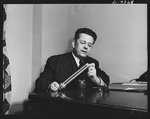 War workers' ideas that saves man-hours and critical materials are evaluated by a board of experts, whose chairman is Ray Millholland of Indianapolis, engineer and author, here shown examining working models submitted by War Production Drive headquarters in Washington. Twelve engineers and technical