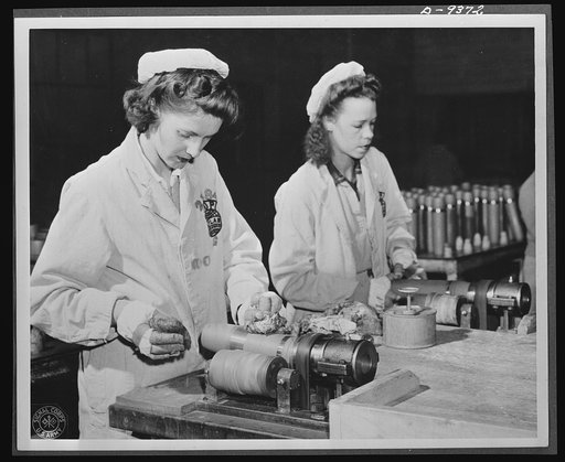 Production. Shell loading. Every shell that goes through a large Midwest loading plant must be thoroughly cleaned. These women are removing excess paint from the bands that circle the projectiles. Women also stencil firing data on the shells and perform many other essential operations. Ravenna ordna