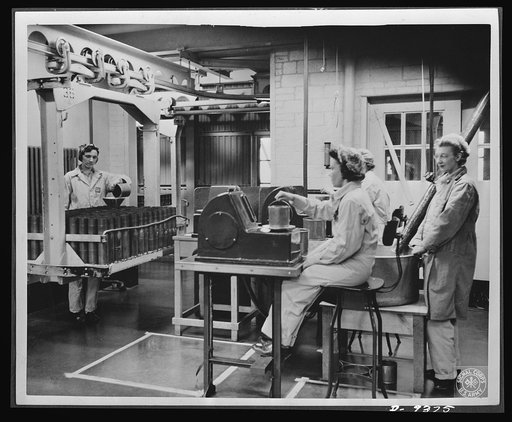 Production. Shell loading. Weighing the propelling charges of smokeless powder before they are poured into shells at a large Midwest loading plant. This precise work is done mostly by women. Mechanical devices produced in the fuse division enable soldiers in the field to delay or accelerate the expl