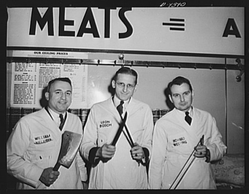 Meat rationing preview. Office of Price Administration (OPA) meat rationing executives who acted as butchers at demonstration for the press sharpen up the tools of the trade in anticipation. William Nielander, Leon Bosch, and Howard Westing with meat-cutting tools