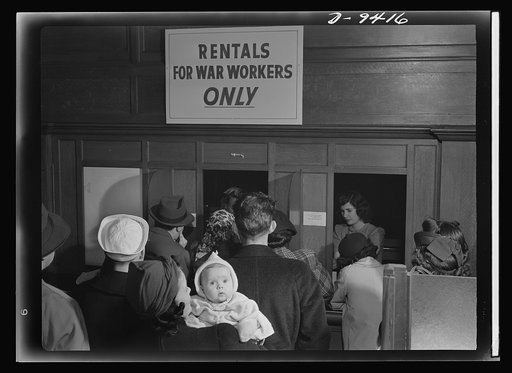 War housing needs. Crowds of homeseekers wait in line for housing information in every "boom town" war housing center. Like millions of Americans who have migrated to busy industrial areas, these newcomers to San Francisco are hoping for news that a house, a room, or even a bed will be made availabl