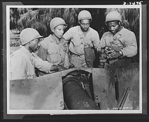 With an airfield security detachment in Hawaii. If jungle fighting becomes necessary, the members of an airfeild security detachment in Hawaii will be prepared. Shown above with machine gun (left to right) are: Private Wilfred Smith, Scotland Neck, North Carolina and Private Floyd Philpot, Jr., Hoga