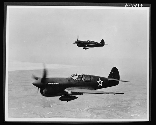 Planes in flight. The P-40 single-engine fighter plane--which the British have used in its various models as the "Tomahawk," "Kittyhawk" and "Warhawk"--is a fast pursuit ship in the 400-mile-per-hour class. It has an approximate service ceiling of 30,000 feet and a range of about 900 miles. Carrying