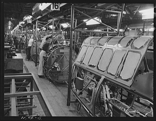 Production. BT-13A ("Valiant") basic trainers. Assembling plumbing and wiring in "Valiant" basic trainers at Vultee's Downey, California plant. At the Downey plant is made the BT-13A ("Valiant") basic trainer--a fast, sturdy ship powered by a Pratt and Whitney Wasp engine