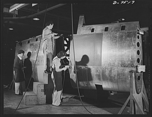 Production. BT-13A ("Valiant") basic trainers. Women working on the center section of a wing for a "Valiant" basic trainer at Vultee's Downey, California plant. At the Downey plant is made the BT-13A ("Valiant") basic trainer--a fast, sturdy ship powered by a Pratt and Whitney Wasp engine