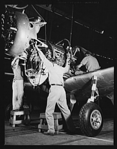 Production. BT-13A ("Valiant") basic trainers. Final inspection of a wing for a "Valiant" basic trainer at Vultee's Downey, California plant. At the Downey plant is made the BT-13A ("Valiant") basic trainer--a fast, sturdy ship powered by a Pratt and Whitney Wasp engine