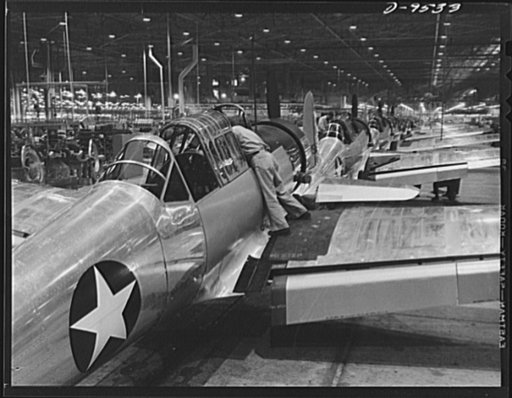 Production. BT-13A ("Valiant") basic trainers. Final assembly line at Vultee's Downey, California plant, showing famous Vultee basic trainers, commonly known as the "Valiant." At the Downey plant is made the BT-13A ("Valiant") basic trainer--a fast, sturdy ship powered by a Pratt and Whitney Wasp en