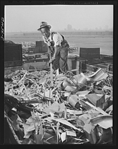 Production. BT-13A ("Valiant") basic trainers. Scrap pile being sorted at Vultee's Downey, California plant. At the Downey plant is made the BT-13A ("Valiant") basic trainer--a fast, sturdy ship powered by a Pratt and Whitney Wasp engine