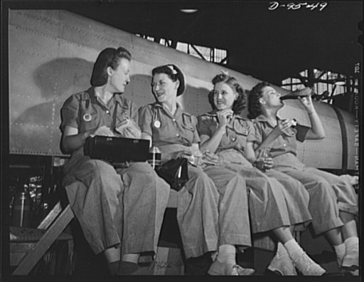 Production. A-31 ("Vengeance") dive bombers. Lunch time. Here's a group of women workers relaxing by their work--a fuselage section of "Vengeance" dive bomber made at Vultee's Nashville Division--and enjoying a well-earned lunch. The "Vengeance" (A-31) was originally designed for the French. It was 