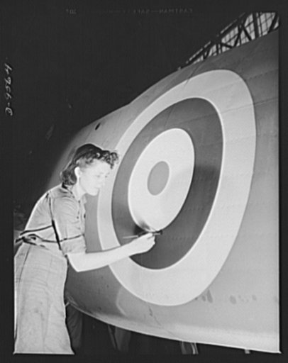 Production. A-31 ("Vengeance") dive bombers. Insignia touch-up. Woman worker is shown retouching the British insignia on the fuselage of a "Vengeance" dive bomber made at Vultee's Nashville Division. The "Vengeance" (A-31) was originally designed for the French. It was later adopted by the RAF (Roya