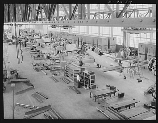 Production. A-31 ("Vengeance") dive bombers. Installing on overhead conveyor. Here is a view of the first complete overhead mechanized final assembly conveyor line during installation at the Nashville Division of Vultee Aircraft Inc., where the "Vengeance" dive bomber is manufactured. The conveyor i