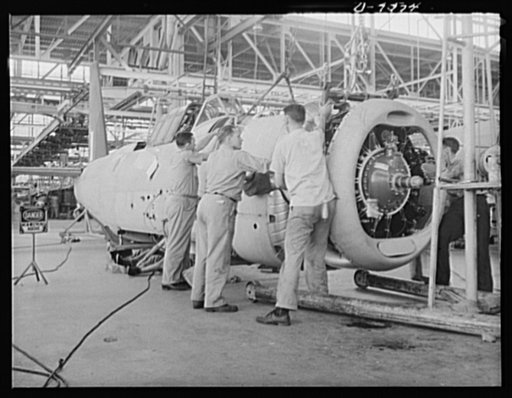 Production. A-31 ("Vengeance") dive bombers. Motor splice. A trio of workers splicing the engine nucleus onto the fuselage of the Vultee "Vengeance" dive bomber manufactured at Vultee's Nashville Division. The "Vengeance" (A-31) was originally designed for the French. It was later adopted by the RAF