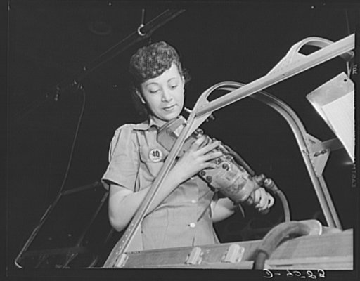Production. A-31 ("Vengeance") dive bombers. Canopy assembly. The girl worker in this scene at the Nashville Division of Vultee Aircraft Inc. is operating a type of rivet gun, one of the steps in assembly of the canopy of the Vultee "Vengeance" dive bomber. The "Vengeance" (A-31) was originally desi