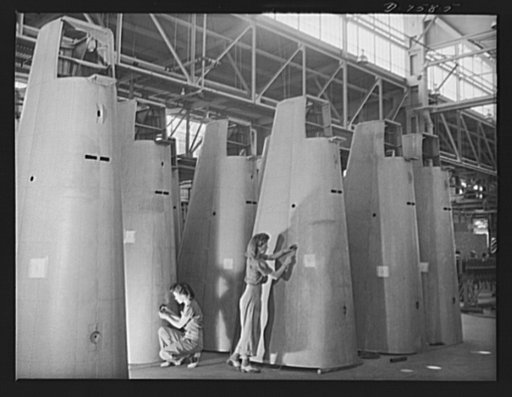 Production. A-31 ("Vengeance") dive bombers. Rivet inspection on a rear monocoque. Two women workers at Vultee's Nashville Division are pictured at their jobs of inspecting rivets in a row of tail cones to be installed in the Vultee "Vengeance" dive bomber. The "Vengeance" (A-31) was originally desi