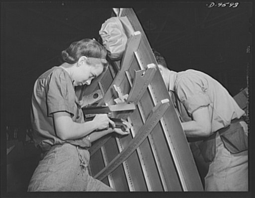 Production. A-31 ("Vengeance") dive bombers. Riveting side section. The man and woman pictured here are riveting a side section for the Vultee "Vengeance" dive bomber now in mass production at the Nashville Division of Vultee Aircraft Inc. The "Vengeance" (A-31) was originally designed for the Frenc