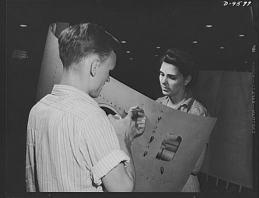 Production. A-31 ("Vengeance") dive bombers. Riveting a side section. This pair of Vultee workers at the Nashville Division are shown riveting a side section for the Vultee "Vengeance" dive bomber. The "Vengeance" (A-31) was originally designed for the French. It was later adopted by the RAF (Royal 