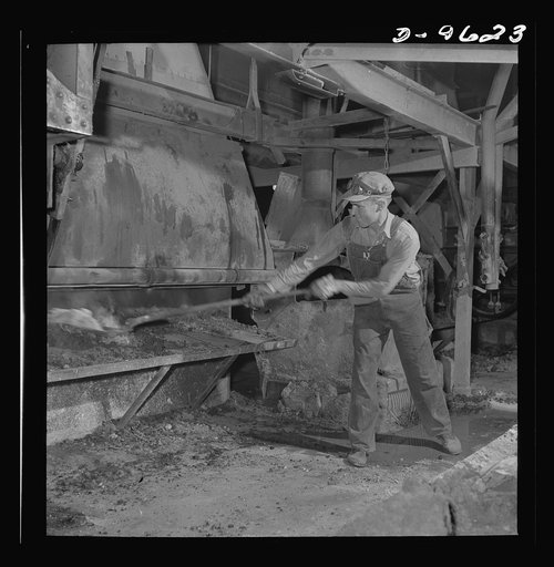 Production. Zinc. Husky worker in a large zinc smelting operation. From the Eagle-Picher plant near Cardin, Oklahoma, come great quantities of zinc and lead to serve many important purposes in the war effort