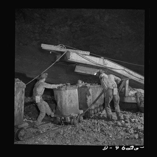 Production. Zinc. A mechanical loader fills buckets with zinc ore in a mine serving a large concentrator. From the Eagle-Picher plant near Cardin, Oklahoma, come great quantities of zinc and lead to serve many important purposes in the war effort