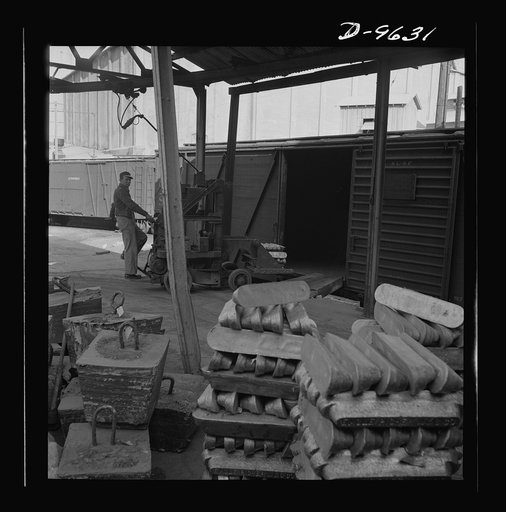 Production. Zinc. Lead in the forms of pigs and of "jumbo-blocks" being loaded on railway cars at a large smelting plant. From the Eagle-Picher plant near Cardin, Oklahoma, come great quantities of zinc and lead to serve many important purposes in the war effort