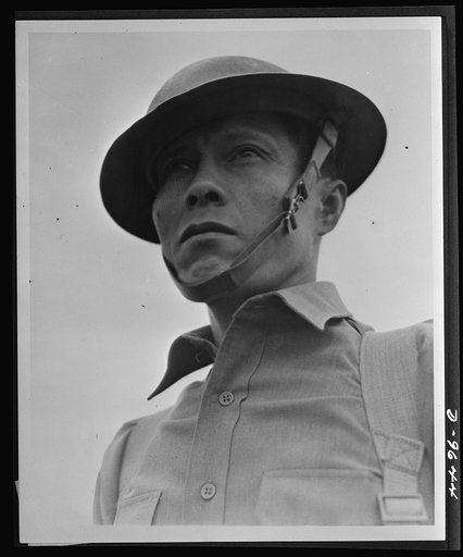 Staff Sergeant Roberto Sarmiento of the Philippine Islands, eighteen years a soldier, typifies the Filipino doughboys who are training with the Filipino regiments in California, and who look forward to the day when they can avenge the overrunning by the Japs of their homeland