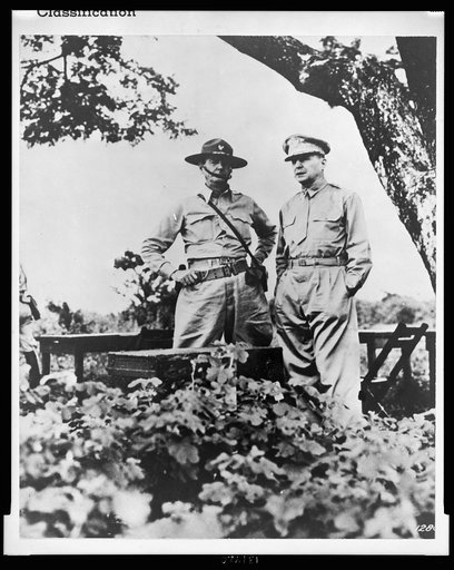 Guiding genius of Bataan was General Douglas MacArthur (right) shown here with Major General Jonathan Wainwright, who assumed command when MacArthur was ordered to Australia