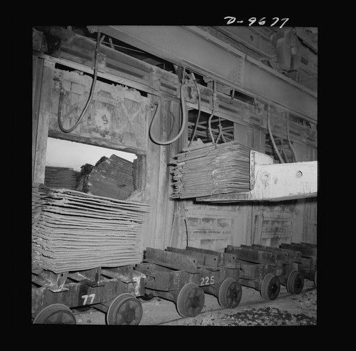 Production. Copper (refining). Charging sheets of copper produced by electrolysis into a furnace at a large copper refining operation. Large amounts of copper are produced for the war effort at the El Paso, Texas plant of Phelps-Dodge Refining Company