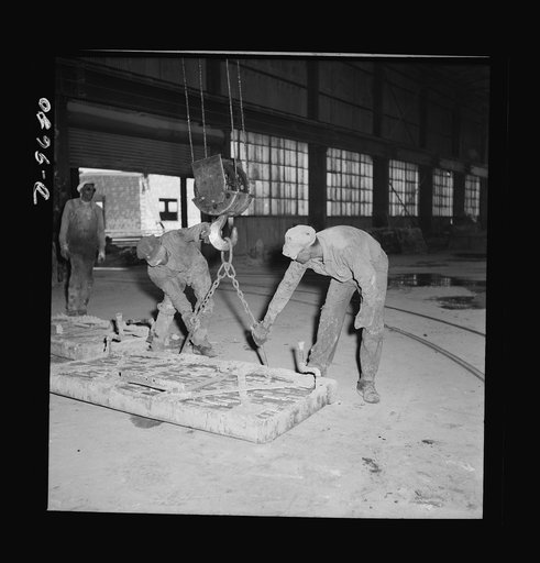 Production. Copper (refining). Handling a fire door for a furnace at a large copper refining operation. Large amounts of copper are produced for the war effort at the El Paso, Texas plant of Phelps-Dodge Refining Company