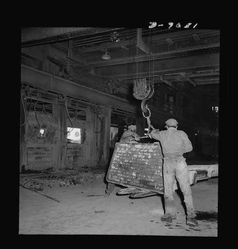 Production. Copper (refining). Handling a fire door for a furnace at a large copper refining operation. Large amounts of copper are produced for the war effort at the El Paso, Texas plant of Phelps-Dodge Refining Company