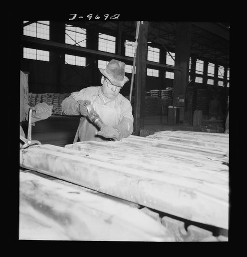 Production. Copper (refining). Trimming bars of pure copper at a large copper refining operation. Large amounts of copper are produced for the war effort at the El Paso, Texas plant of Phelps-Dodge Refining Company