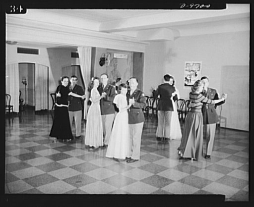 War workers. Social activities.  Government girls at Scotts' Hotel, Washington, D.C., dance with their Army officer friends in the hotel auditorium