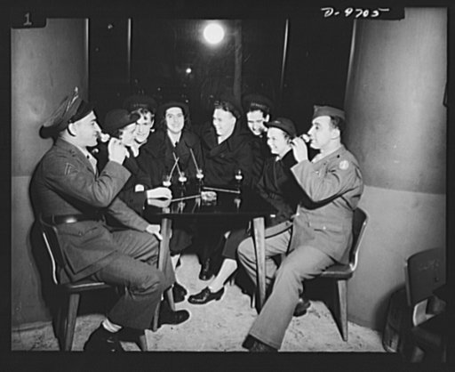 War workers. Social activities.  A group of soldiers, sailors and WAVES (Women Accepted for Voluntary Emergency Service) enjoy refreshments at a Washington, D.C. servicemen's center