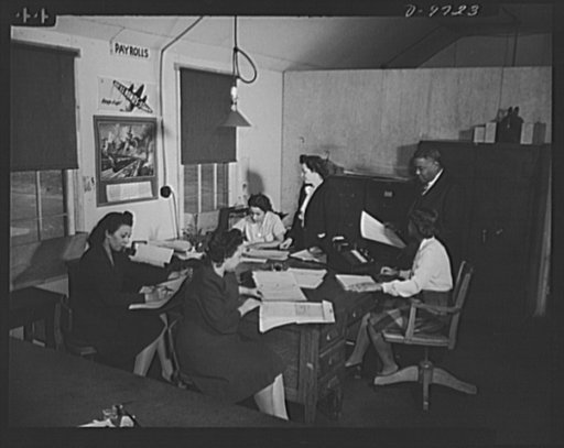 Plato's office staff for Wake and Midway Halls. Samuel Plato, contractor, and part of his office staff at their field headquarters for the construction of Wake and Midway Halls, now being completed for 1,000 Negro women war workers in Washington, D.C. Left to right: Zelda S. Wilson, Mildred Dunn, Wi