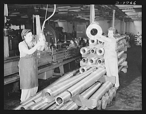 Production. 105 mm. howitzers. Lillian Goritschnig and her helper, Frances Heipek, removing turned 105 mm. howitzers from stockpile for honing operation at the Milwaukee, Wisconsin plant of Chain Belt Company