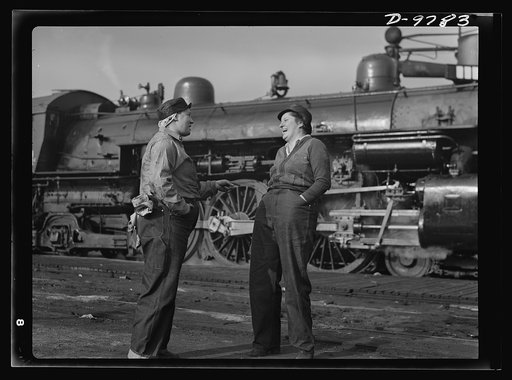 Women in essential services. Two women railroad workers enjoy a moment of relaxation from their new job in the yards of the Southern Pacific Company in San Francisco