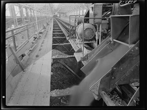 Production. Copper. Copper ore being discharged through a portable feeder into the fine ore bins at the Arthur, Utah copper concentrator of the Utah Copper Company