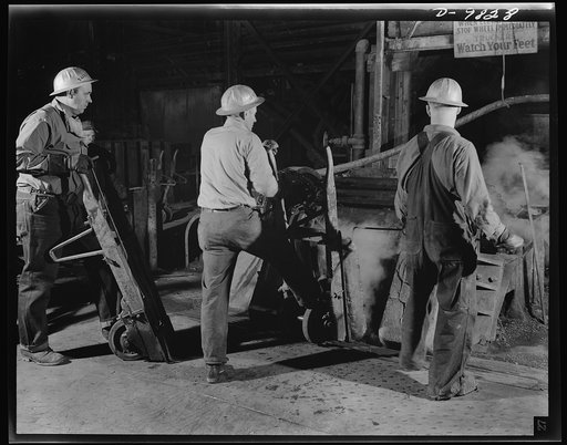 Production. Copper. Removing slabs of blister copper from molds in which they were cast at the Garfield, Utah smelter of the American Smelting and Refining Company