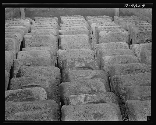 Production. Copper. Slabs of blister copper stacked in a freight car at the Garfield, Utah smelter of the American Smelting and Refining Company for shipment to an Eastern refinery