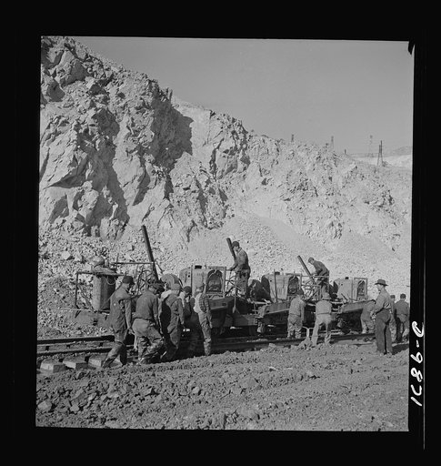 Utah Copper: Bingham Mine. Track-laying crew at open-pit mining operations of Utah Copper Company, at Bingham Canyon, Utah