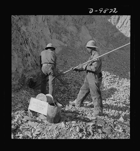 Utah Copper: Bingham Mine. Tamping a blasting charge at the open-pit mining operations of Utah Copper Company, at Bingham Canyon, Utah