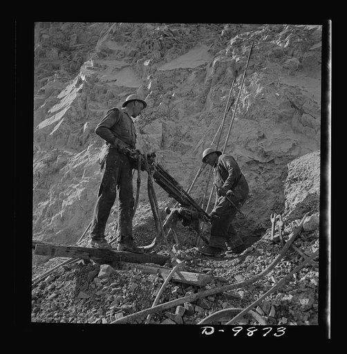 Utah Copper: Bingham Mine. Drilling blast holes with a rock-drill machine at the open-pit mining operations of Utah Copper Company, at Bingham Canyon, Utah
